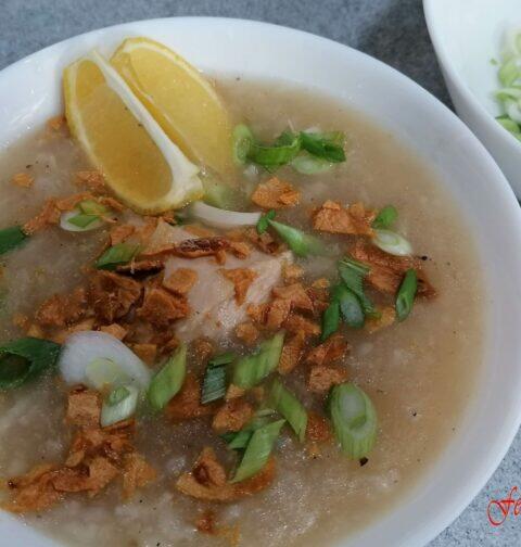 Chicken arroz caldo with toppings