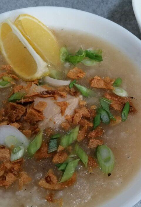 Chicken arroz caldo with toppings