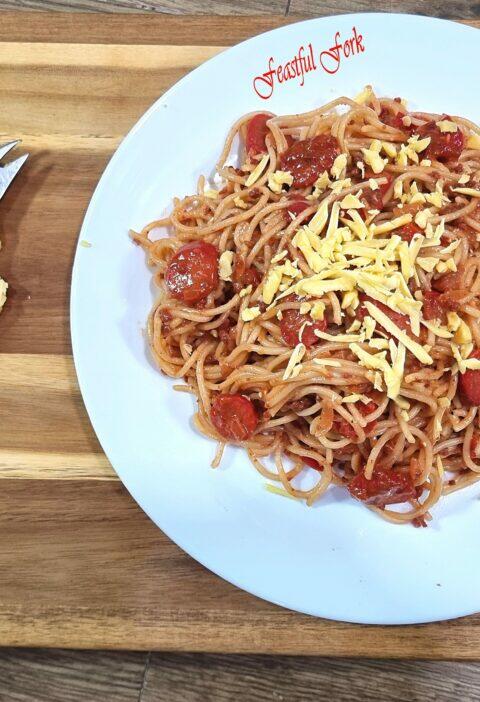 Spaghetti on a Plate with Cheddar Cheese