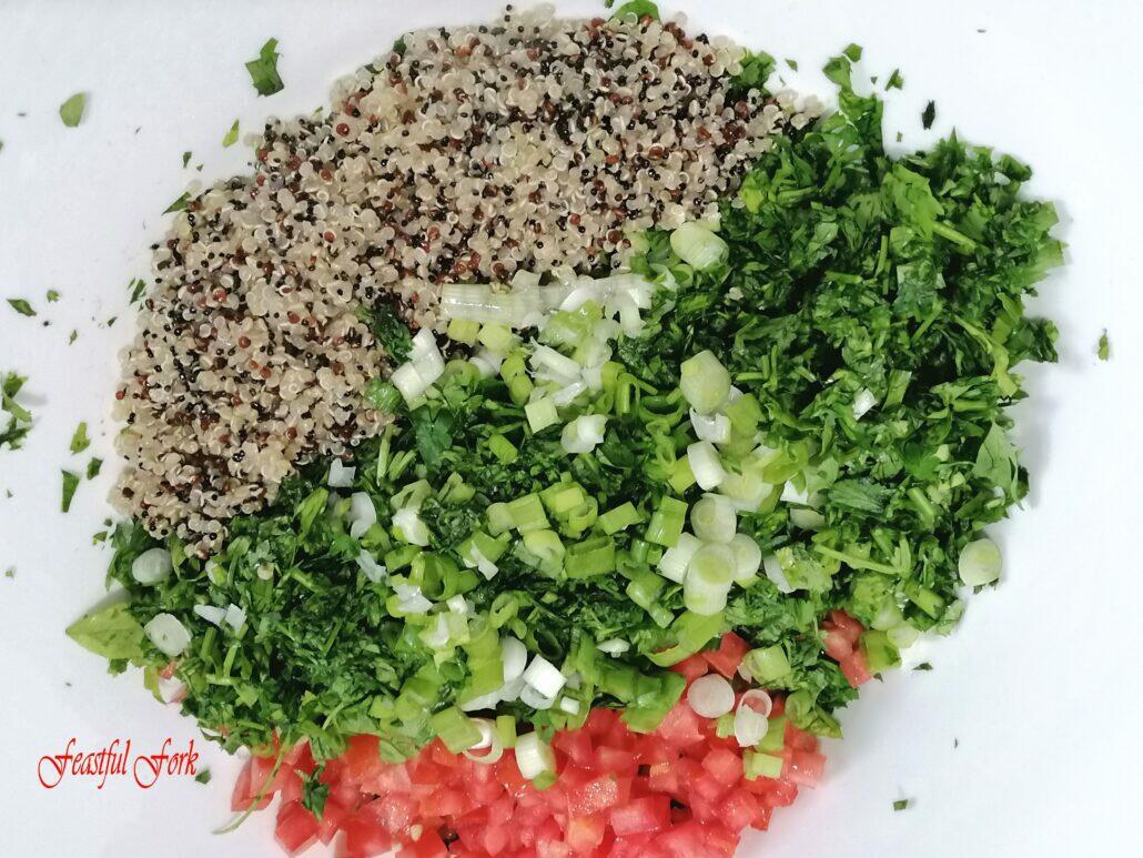 Pre-mixing quinoa and vegetables for tabbouleh