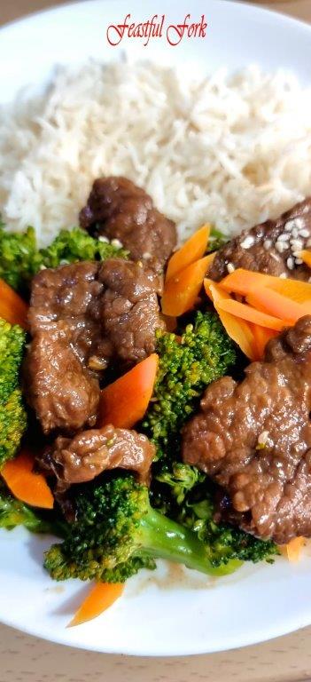 Beef cooked in oyster sauce with broccoli and carrots