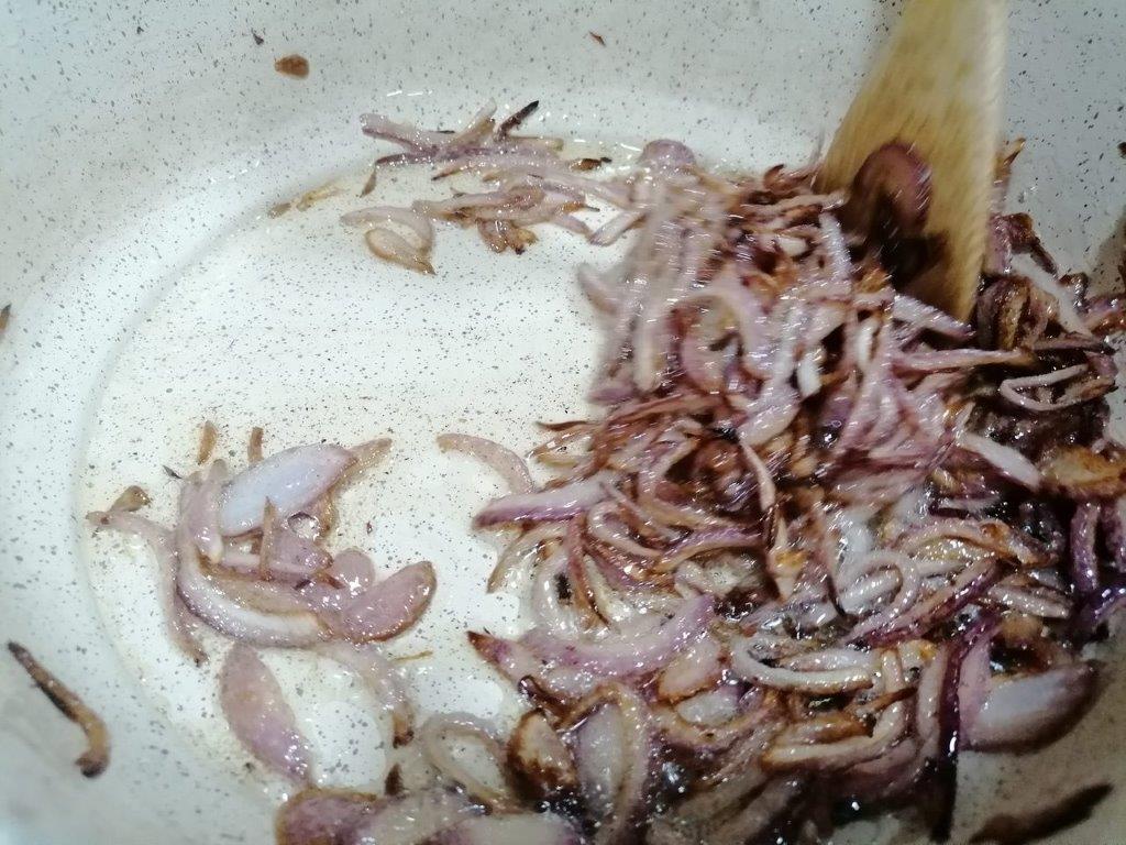 Frying onions for chicken kacchi biryani