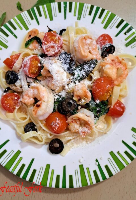 Shrimp and Pasta with Spinach on a Plate