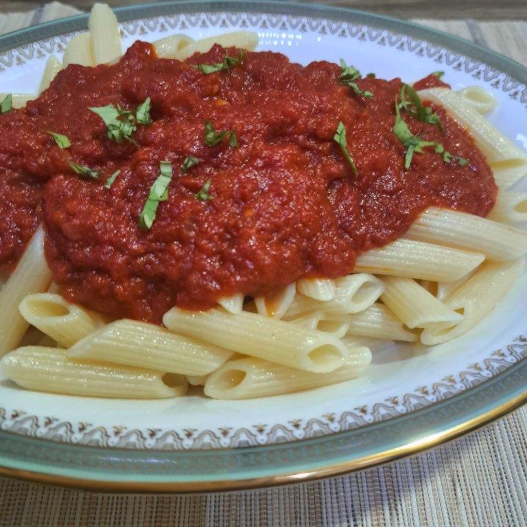 Marinara sauce over penne pasta