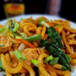 Stir fried udon noodles on a plate