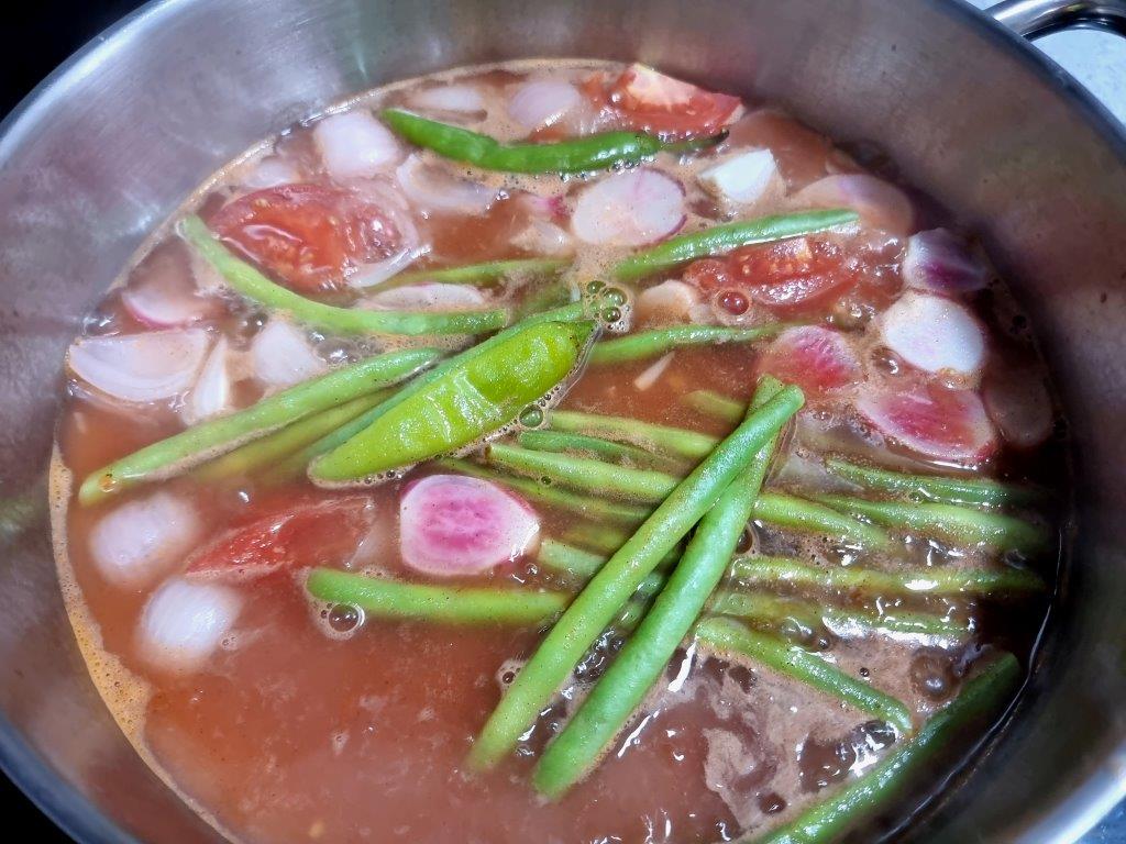 Choice vegetables and juice of lemon for salmon belly sinigang