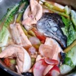 Salmon head and belly with vegetables in juice of lemon