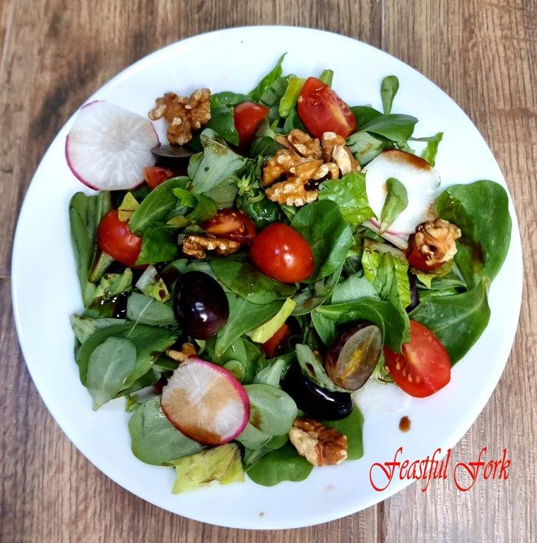 Salad with Grapes and Walnuts on a Plate