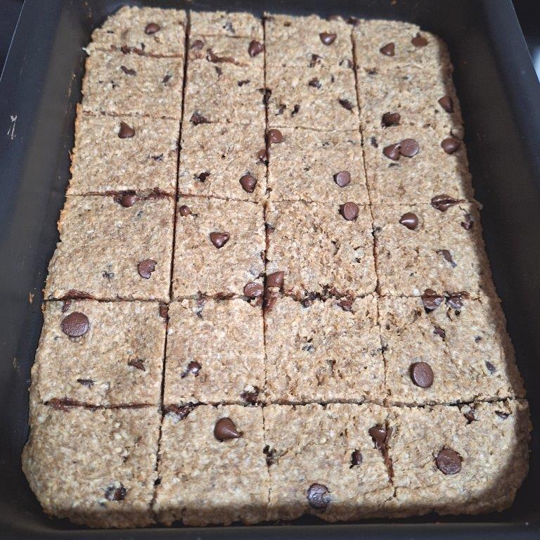 Oatmeal and chocolate chip bars on baking pan